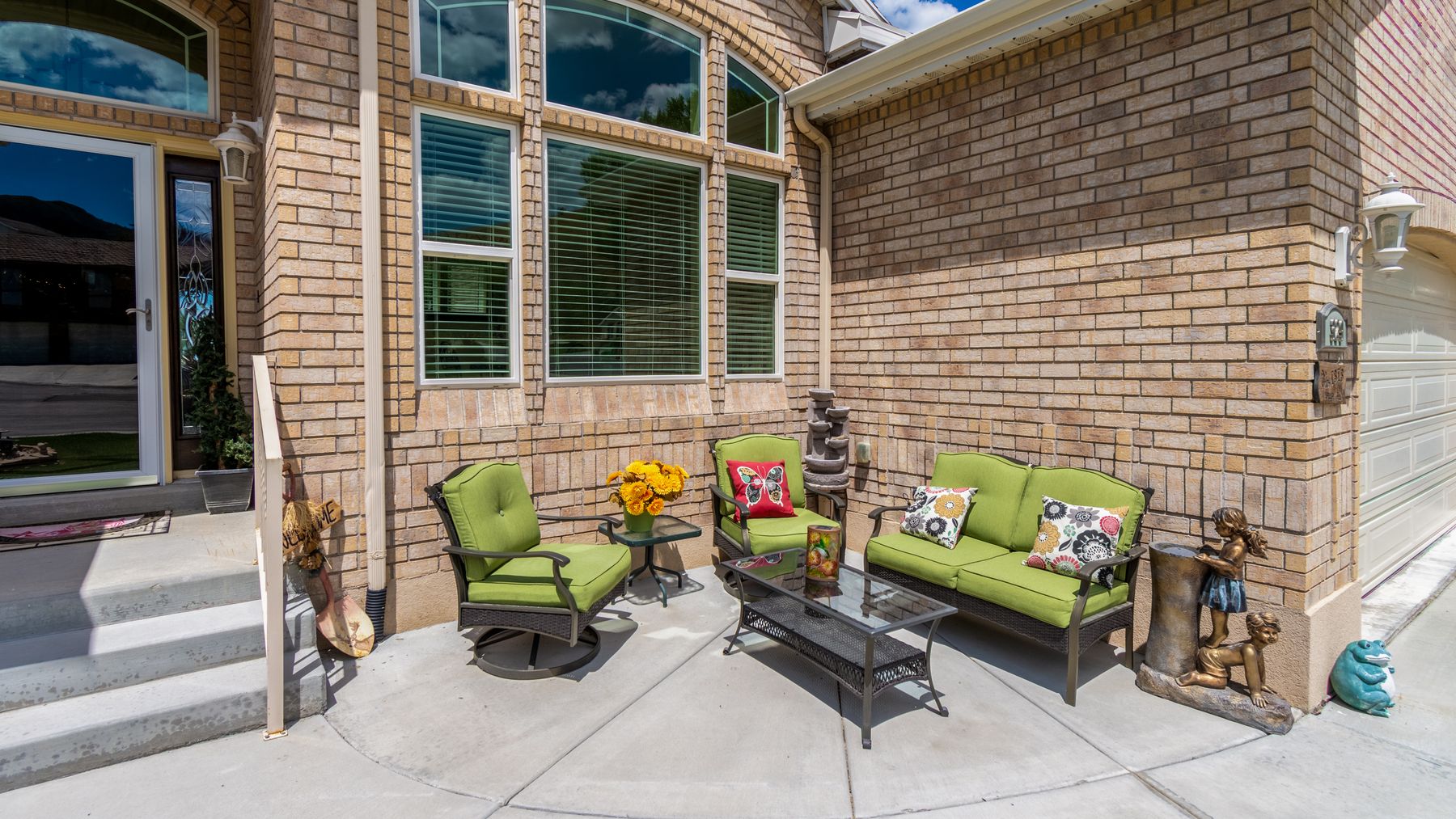 Paver patio behind a brick home